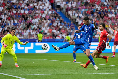 Italy's Gianluca Scamacca shoots on goal